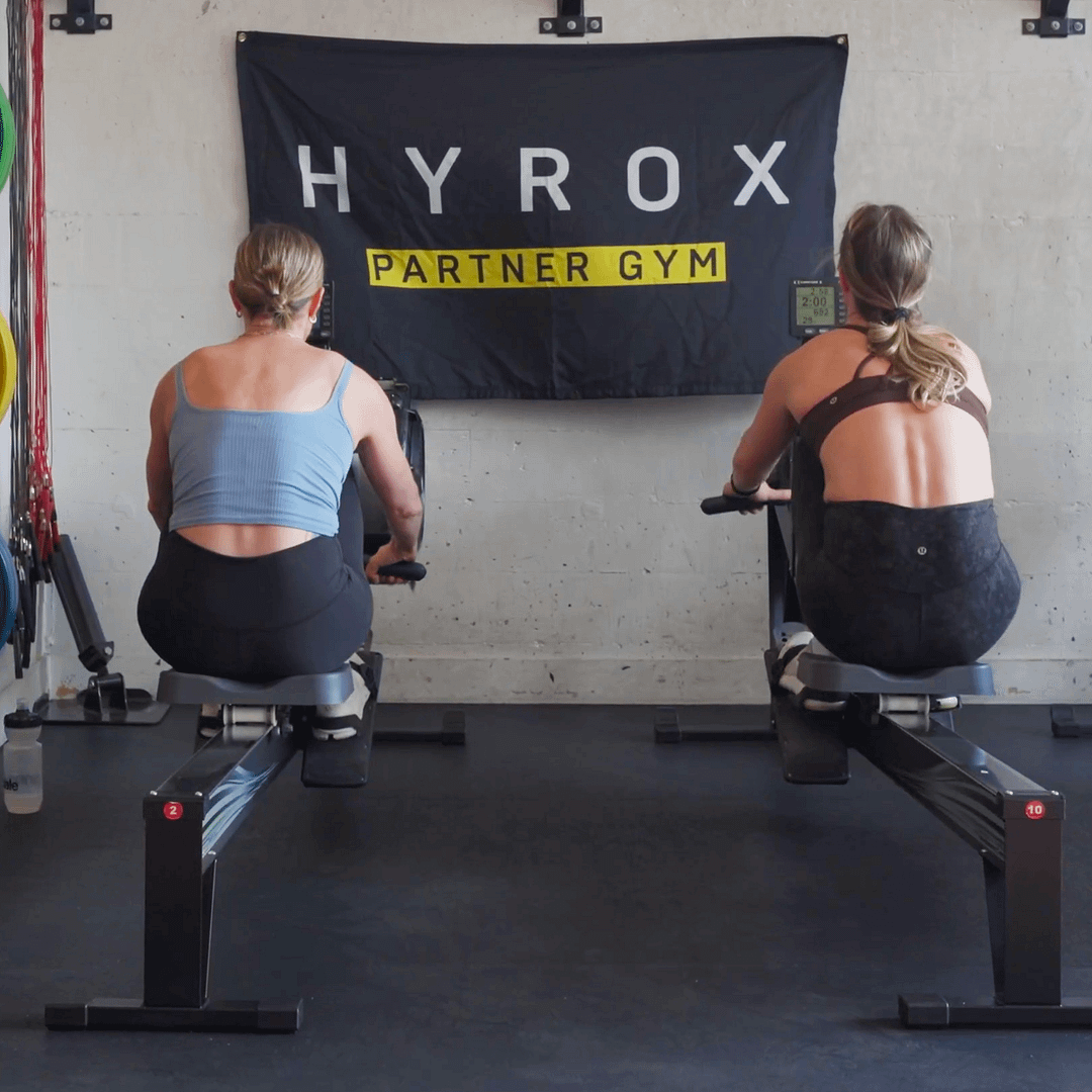 Two girls rowing on Concept 2 row ergs in BPM Fitness Centre