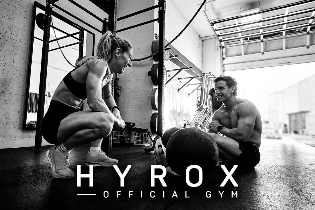 Two HYROX athletes and a wall ball in BPM Fitness Centre