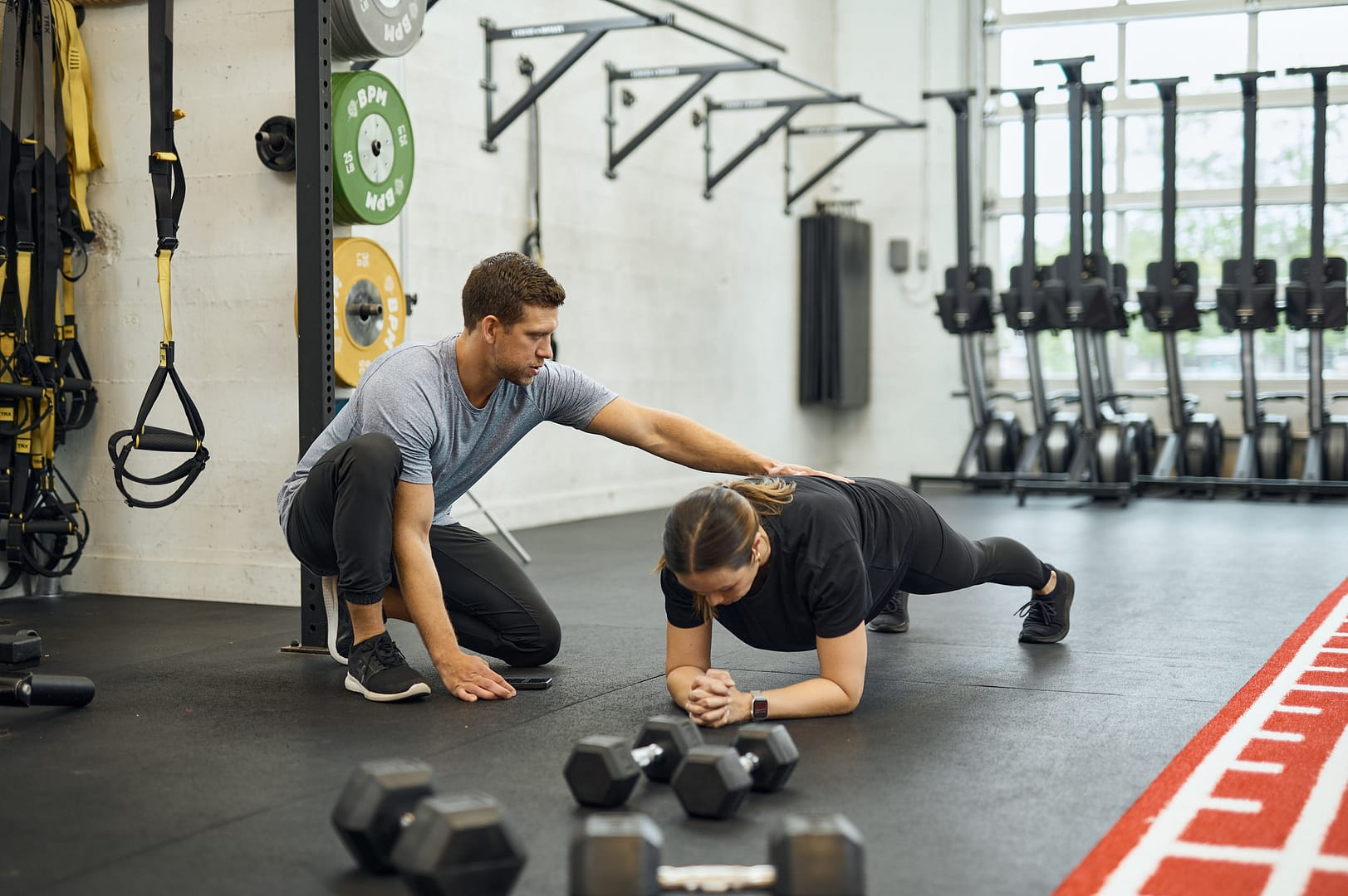 a woman working out with the best personal trainer in victoria bc