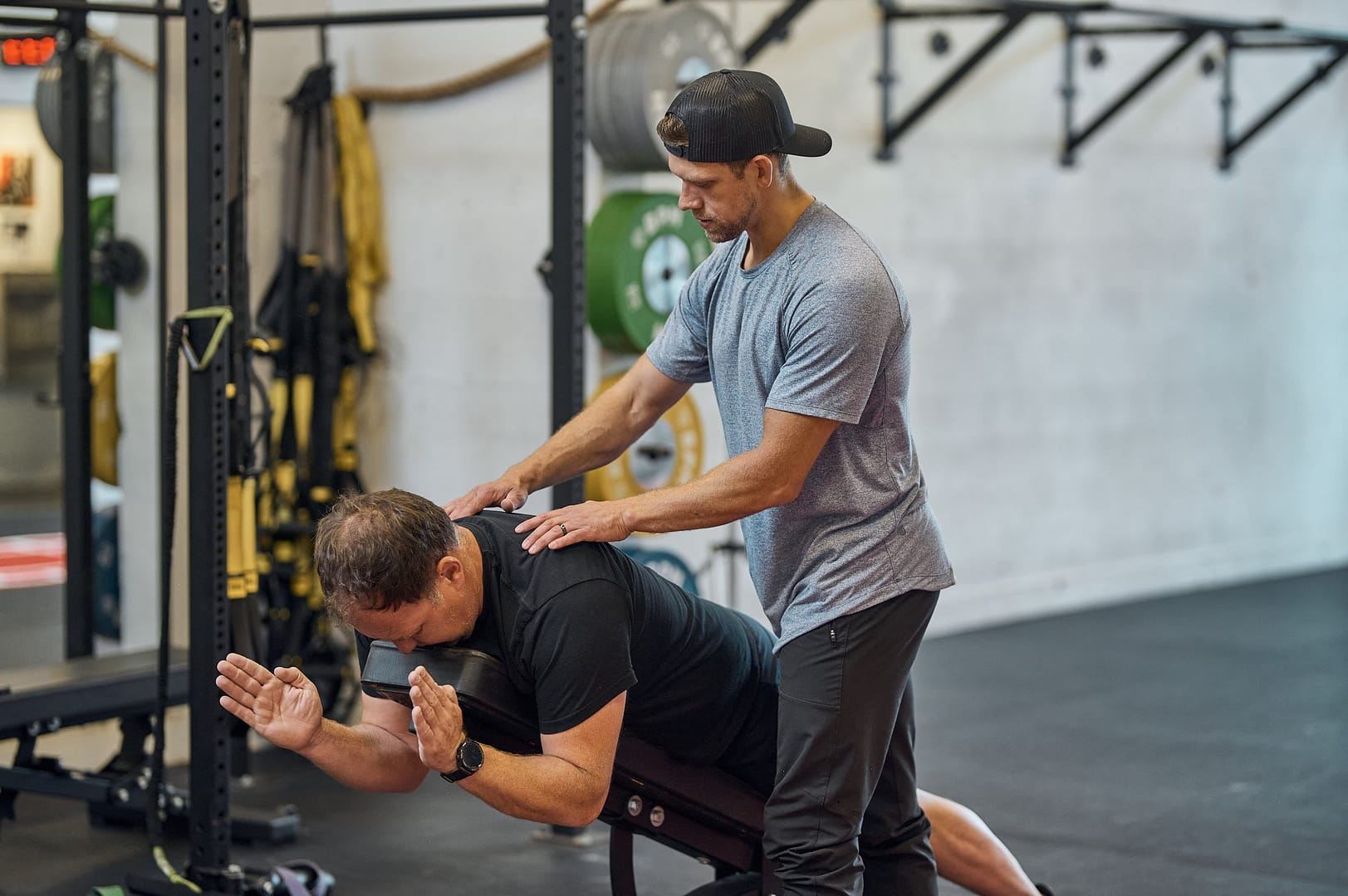 personal trainer in victoria, bc assisting a client with mobility