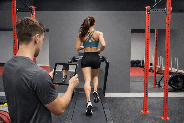 girl doing a running gait analysis on a treadmill at bpm fitness centre