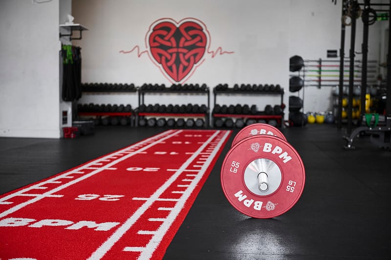 A barbell and turf for HYROX in BPM Fitness Centre private Personal Training Studio