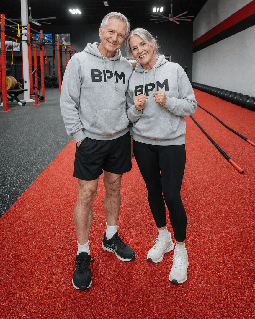 Two seniors standing in a gym at BPM Fitness Centre in Victoria, BC