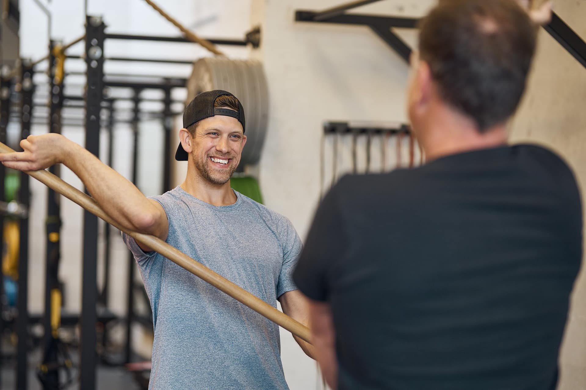 Victoria,BC Personal Trainer Keelan Clemens with client doing mobility exercises