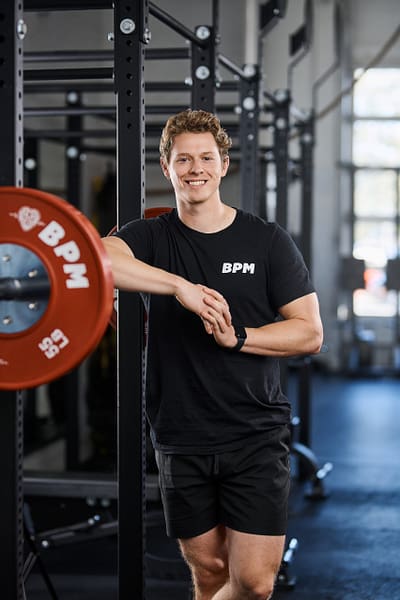 "Personal trainer explaining workout techniques to a client for optimal results.